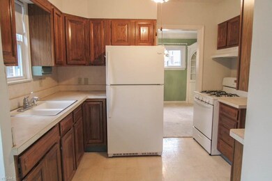 Spacious eat-in kitchen with ample cabinets.