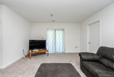 Living room featuring light colored carpet
