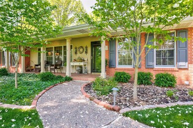 COMING BACK AROUND TO THE FRONT, TAKE THE WINDING PATH TO THE FRONT DOOR.  YOU'LL SEE PEONIES, DOGWOOD, BOXWOOD, IVY AND MORE ON YOUR WAY.
