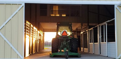 A wide, functional center aisle makes barn operati