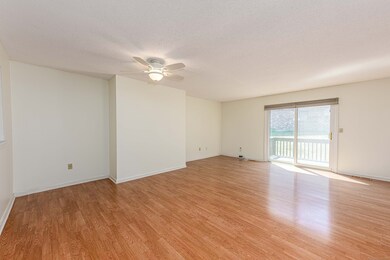 Living/Dining room combination. Laminate flooring. Sliders to deck.