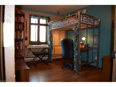 2nd bedroom with wood floor.