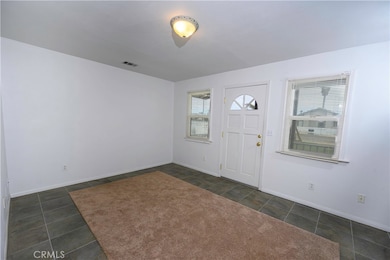 Living room and entry door to house
