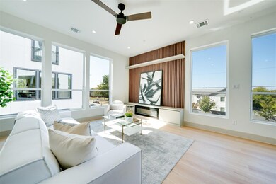 Living room with light hardwood / wood-style floor