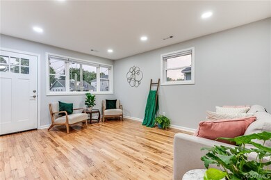 Living area with light hardwood flooring and plent