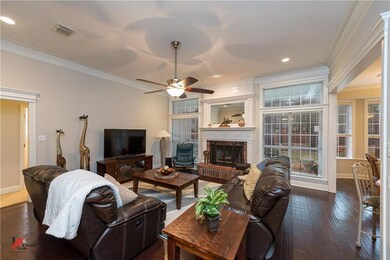 Living room centers on gas fireplace and wall of w