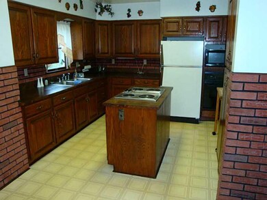Kitchen. Large EIK with an island stove top.