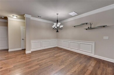 Empty room featuring crown molding, a notable chan