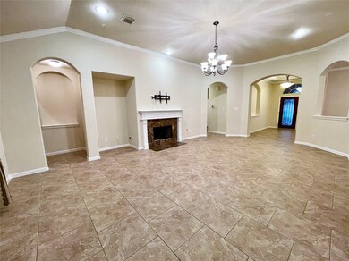 Spacious living area with tiled flooring, a centra