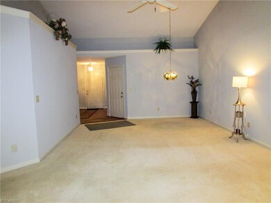The Open Living Room/Dining Room Combination Features a Cathedral Ceiling With Display Ledges.
