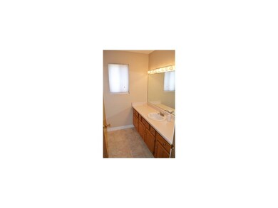 Master Bathroom. Huge vanity, tile floors, and sho