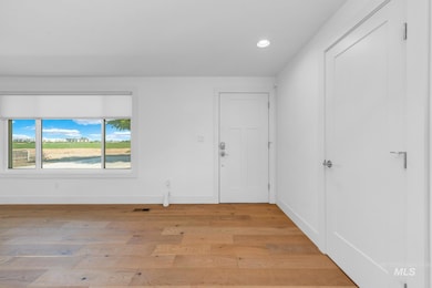 Foyer entrance featuring recessed lighting and light wood-style flooring