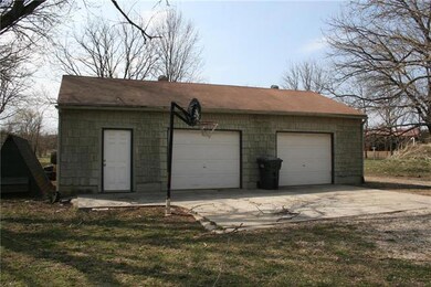 Garage / Shop is 52 ft x 22 ft with a large overha