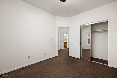 Unfurnished bedroom featuring baseboards, a closet
