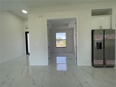 Empty room with baseboards and light marble finish flooring
