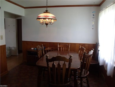 Close up of the eating area in the kitchen.  Large window allows you to view the backyard and patio area.  Not shown in the photo is the back door that is to your right.