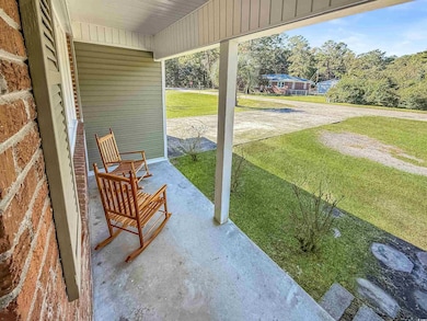 Covered porch with a yard