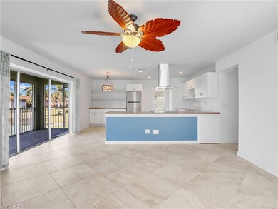 Kitchen featuring stainless steel refrigerator, ha