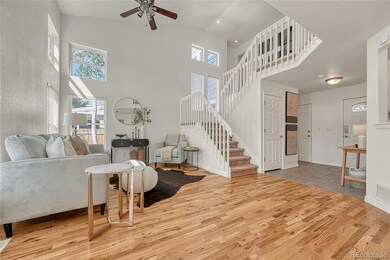 Enjoy the soaring high ceilings with a ceiling fan, fresh paint and multiple windows allowing light to pour in.