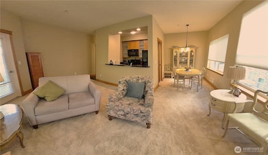 Wide Angle shot of  Living Room, Kitchen and Dining Area.