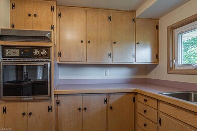 Kitchen has large window with beautiful view of th