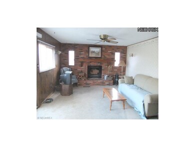 The family room offers a neutral layout with a ful