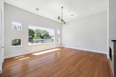 The spacious living room is on the front of the ho