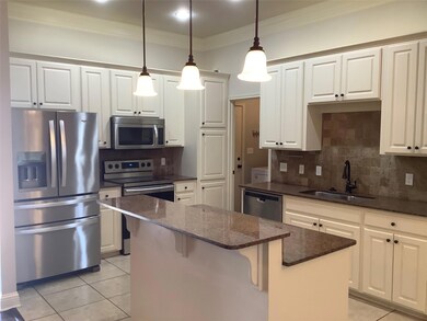 Kitchen with appliances with stainless steel finis