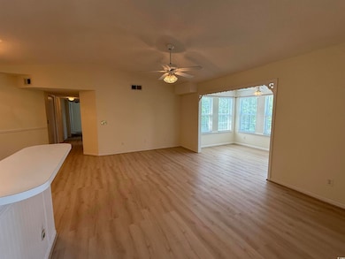 Unfurnished living room featuring light wood-style