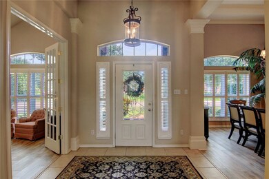 Enter to a large family room with fireplace or wal