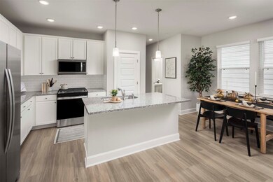 Kitchen with stainless steel appliances - gas rang