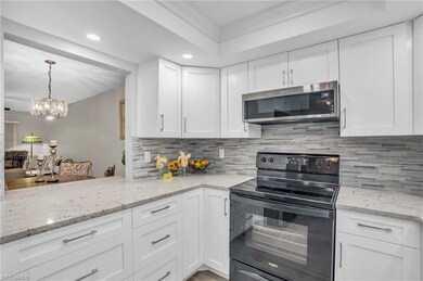 MODERN KITCHEN WITH WHITE CUSTOM CABINETRY, GRANIT