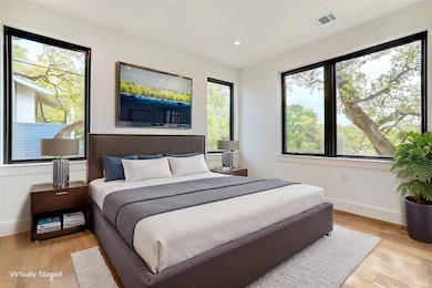 Bedroom featuring baseboards, light wood finished