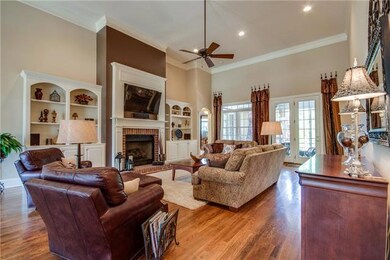 With 19 ft high ceilings, a gas-log fireplace with brick surround & built-ins, the Great Room is the perfect center for this wonderful home.