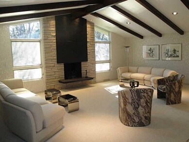 Living Room. The living room offers a vaulted, bea