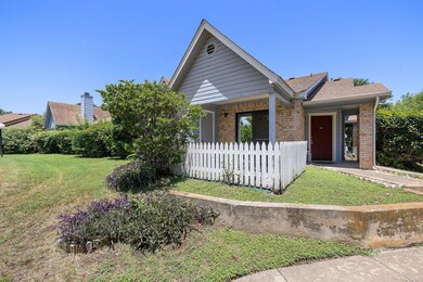 Single story home with brick siding and roof with