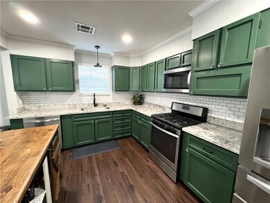 Another view of the Kitchen with lots of cabinets 