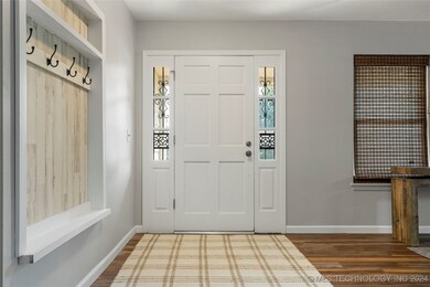 Bright entryway with handy hooks for coats, bags,