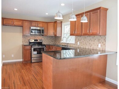 Kitchen has a breakfast bar.