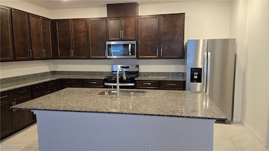 Kitchen with stainless steel appliances, light til