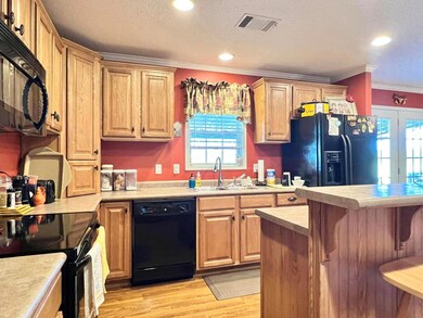 Kitchen featuring black appliances, ornamental mol