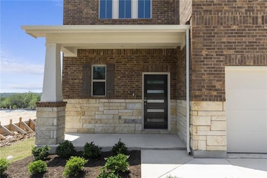 Property entrance featuring covered porch, an att