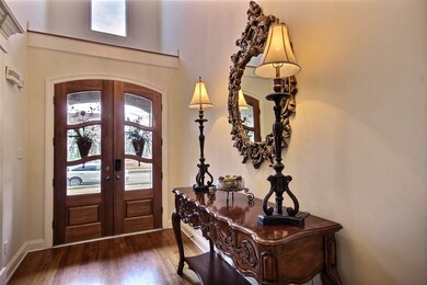 Bright two-story entry with beautiful hardwood flo