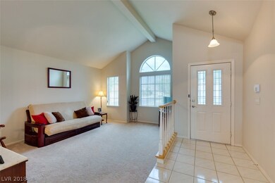 Step Down Formal Living Room with vaulted ceiling.