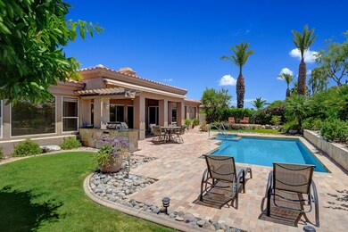 GRASS YARD AND CHAISES TO POOL AND BACK
