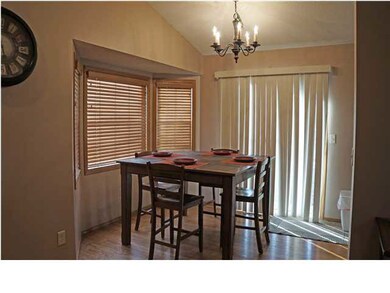 Dining area with a door leading to the backyard pa