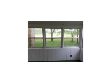 Porch. Wonderful enclosed porch that overlooks yar