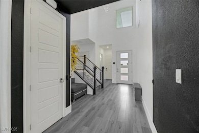 Entrance foyer with baseboards, plenty of natural