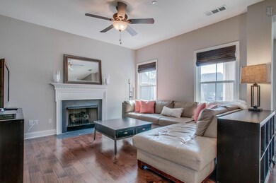 What a space! The open Family Room features comforts such as a gas fireplace with slate surround & dental molding, as well as bamboo shades and a ceiling fan.  