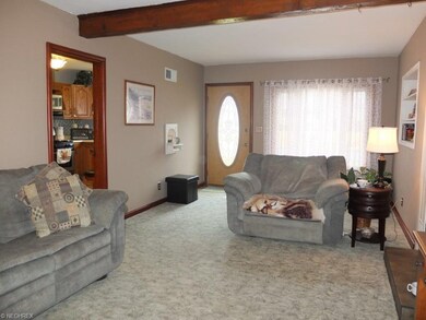 Living room leads to the kitchen.